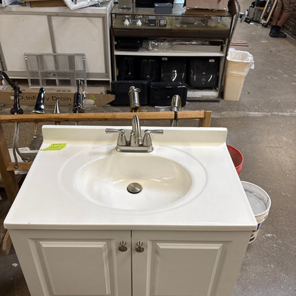 White vanity with top and faucet