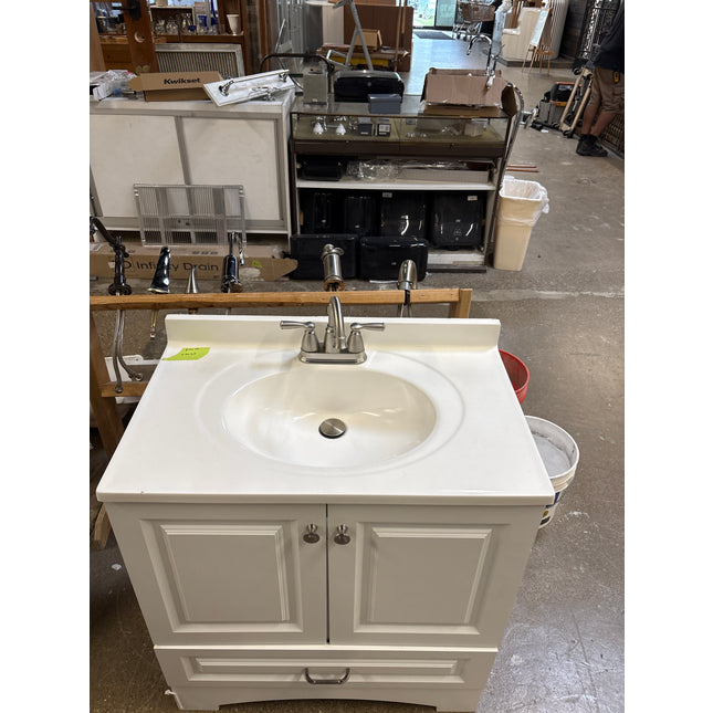 White vanity with top and faucet